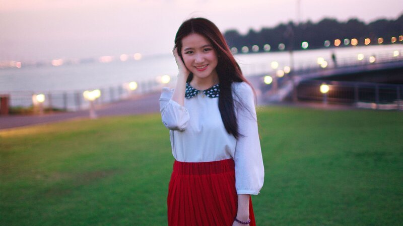 woman in red skirt at sunset