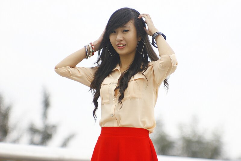 woman in red skirt smiling