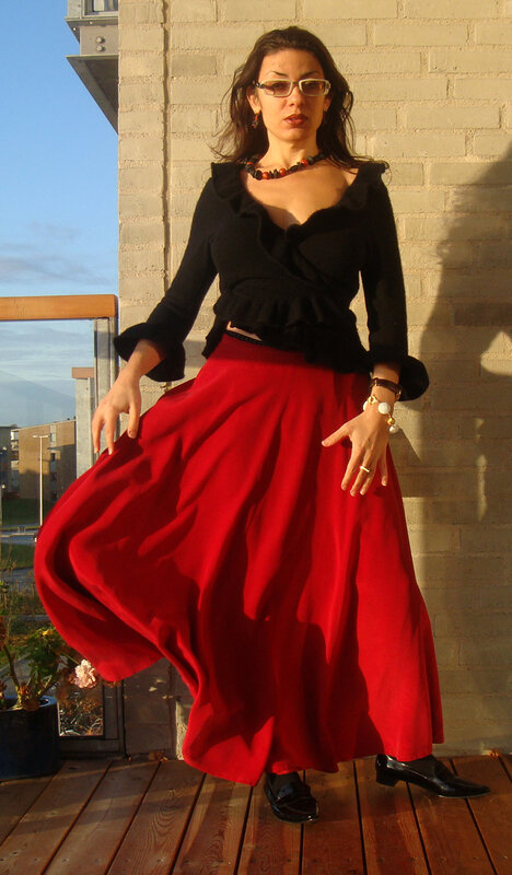 Woman in red skirt twirling