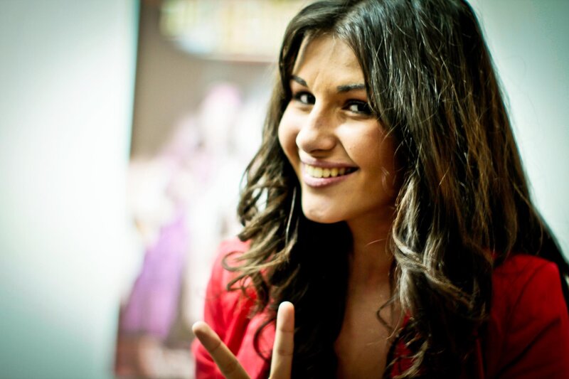 woman in red smiling