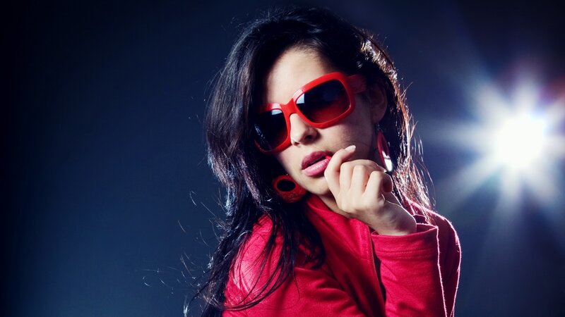 woman in red sunglasses and jacket