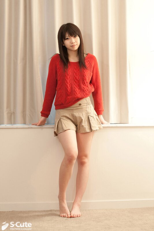 Woman in red sweater and shorts