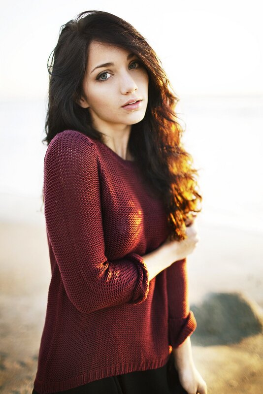 woman in red sweater at beach