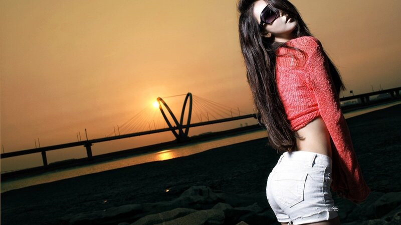 woman in red sweater at sunset