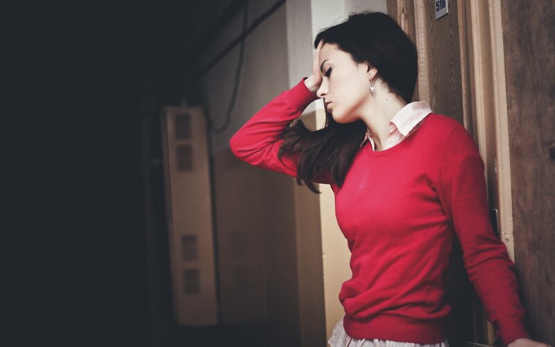 woman in red sweater leaning