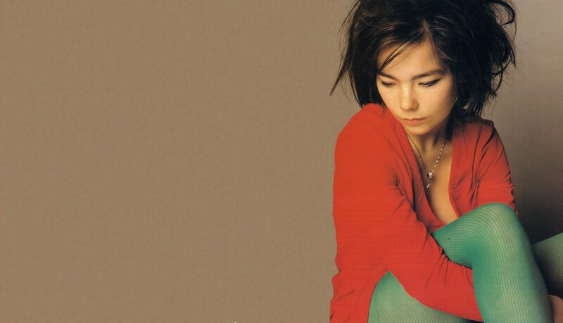 woman in red sweater looking down