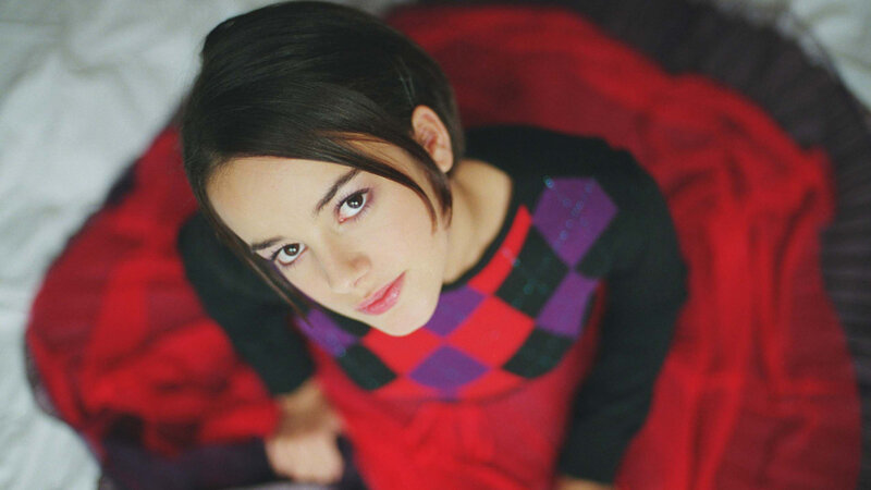 woman in red sweater looking up