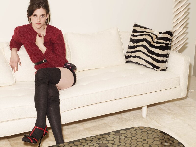 Woman in red sweater on couch