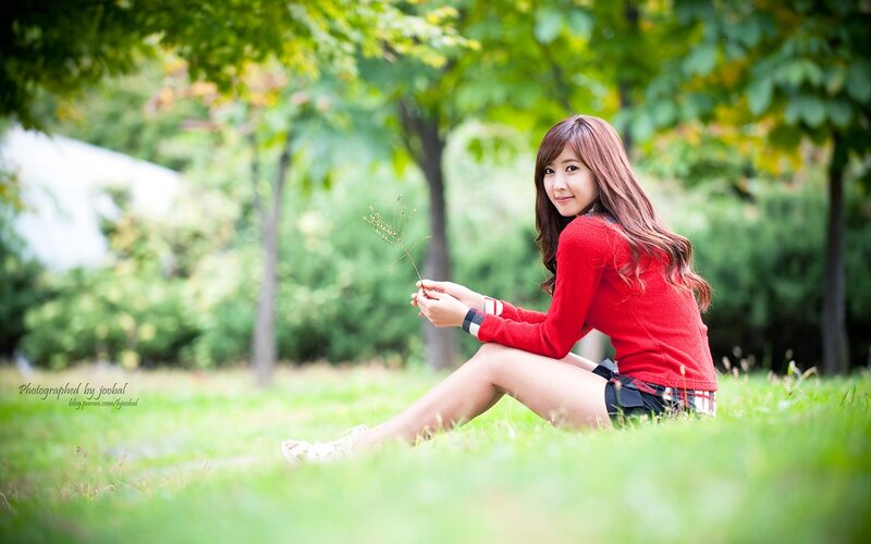 woman in red sweater on grass