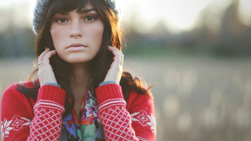 woman in red sweater outdoors
