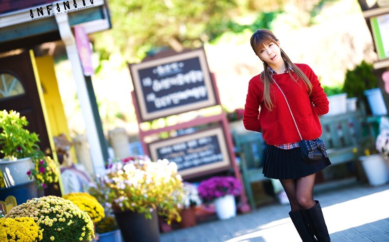 woman in red sweater outdoors