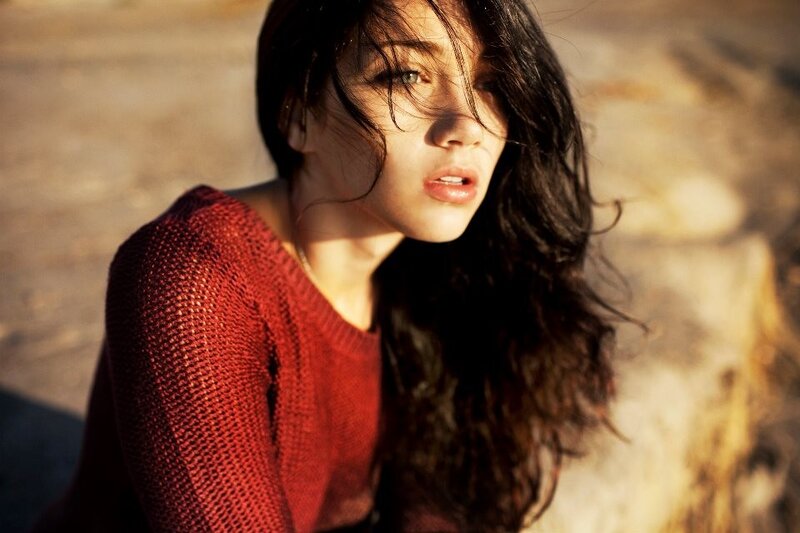 woman in red sweater outdoors