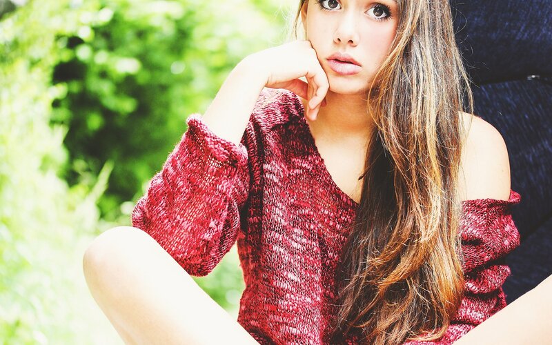 woman in red sweater outdoors