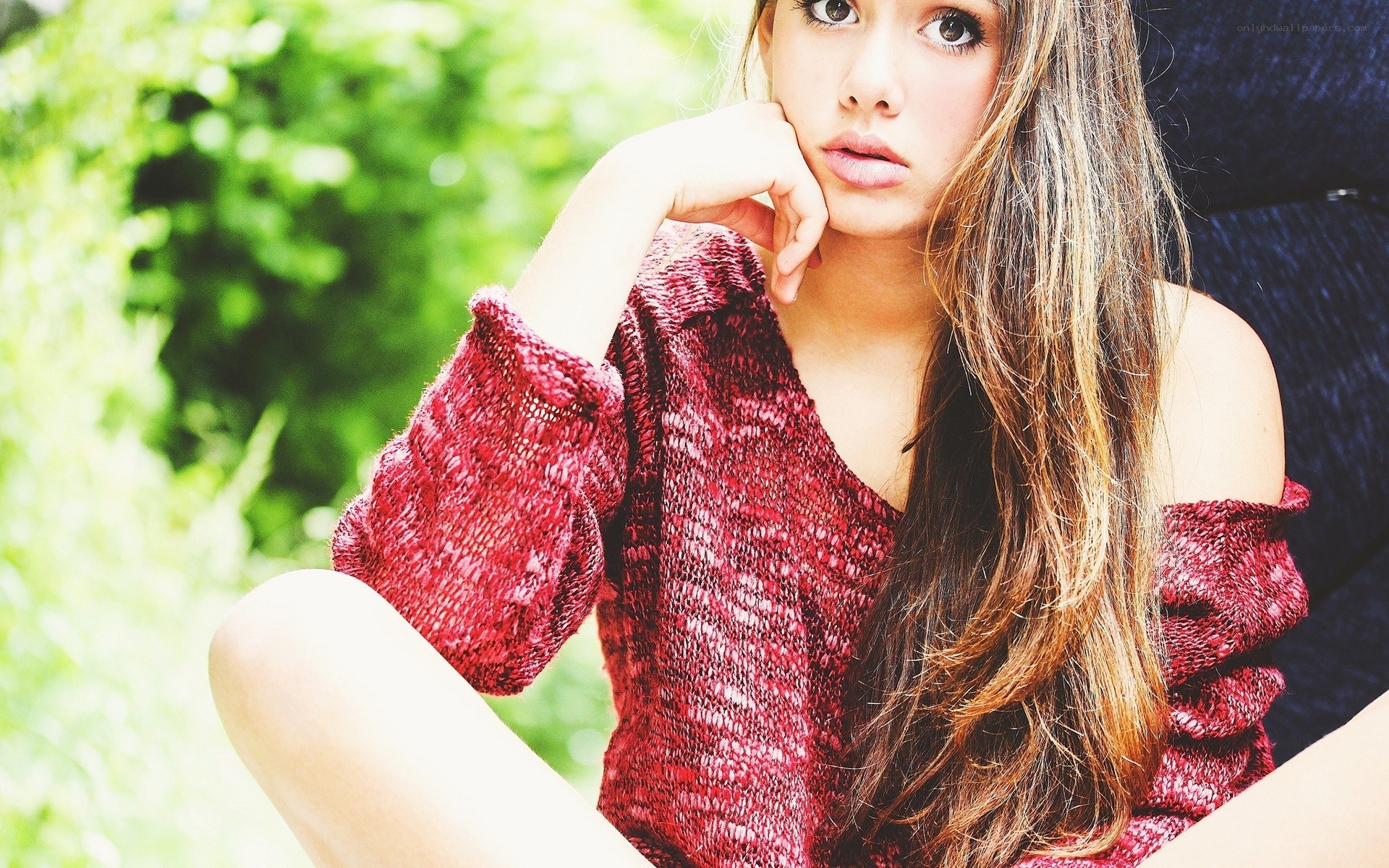 woman in red sweater outdoors