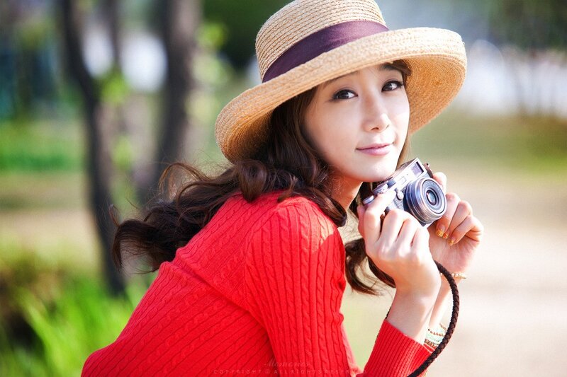 Woman in Red Sweater — Serene, Afternoon, Photograph, Straw Hat