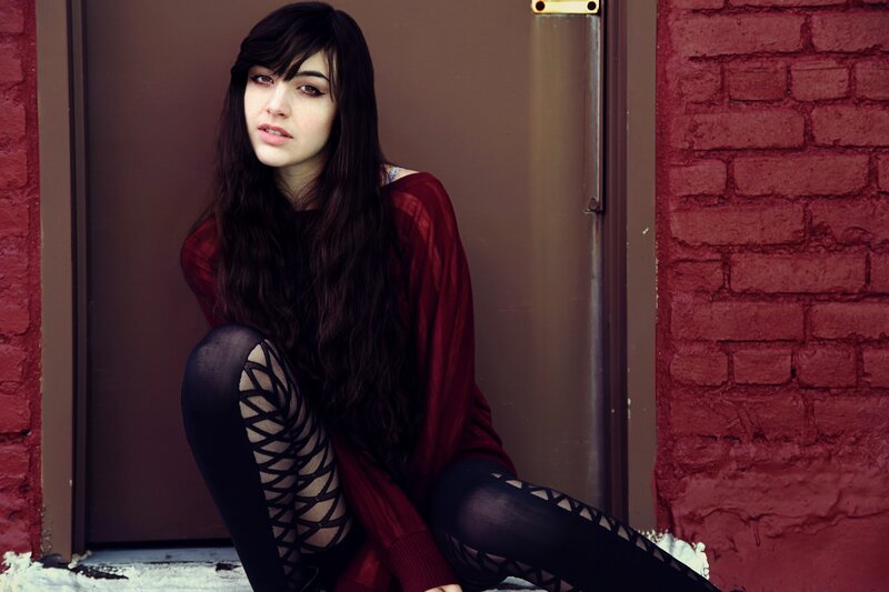woman in red sweater sitting