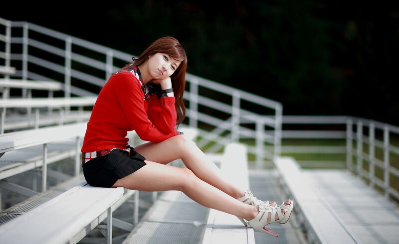 woman in red sweater sitting