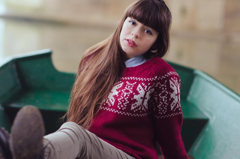 woman in red sweater sitting