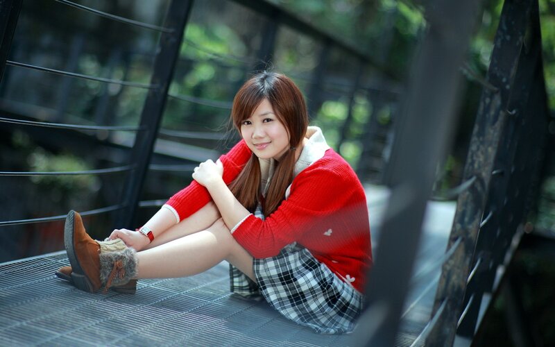 woman in red sweater sitting