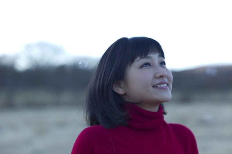 woman in red sweater smiling