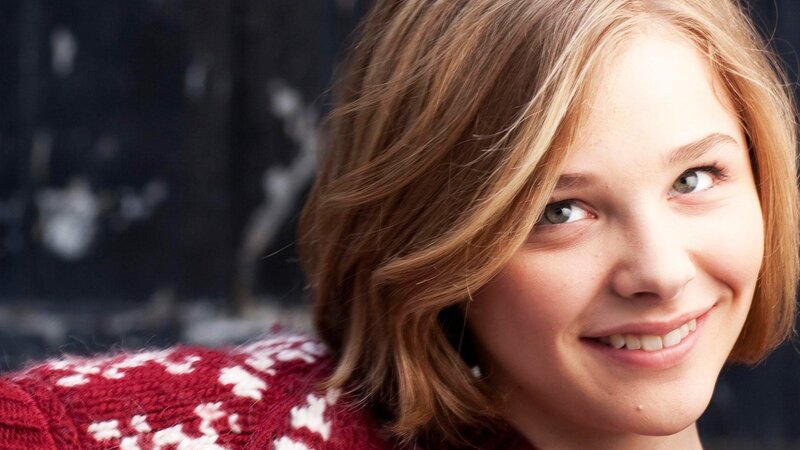woman in red sweater smiling