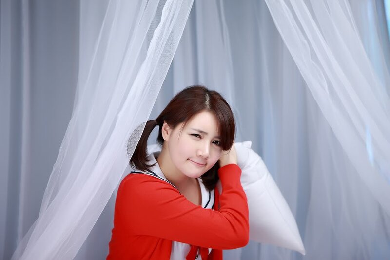 woman in red sweater smiling
