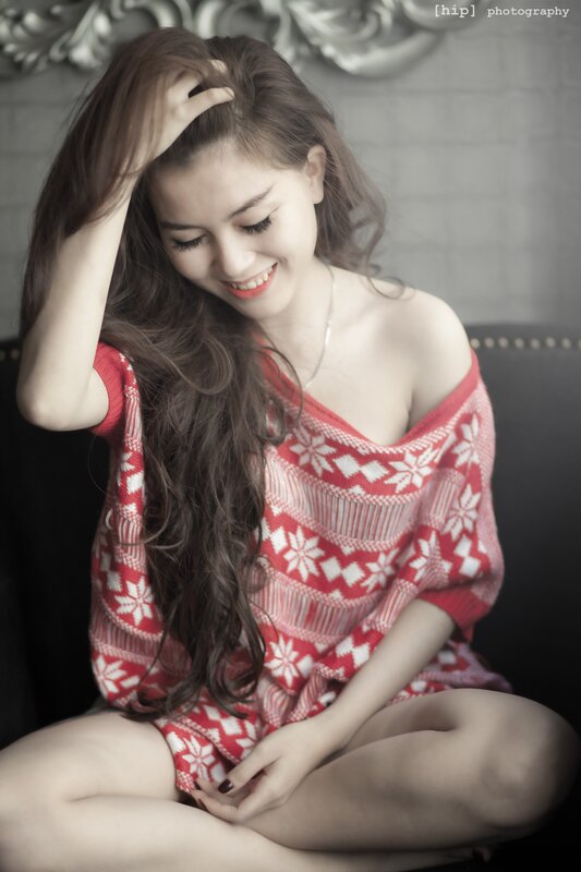 woman in red sweater smiling