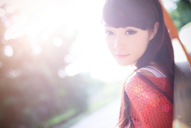woman in red sweater with sunlight