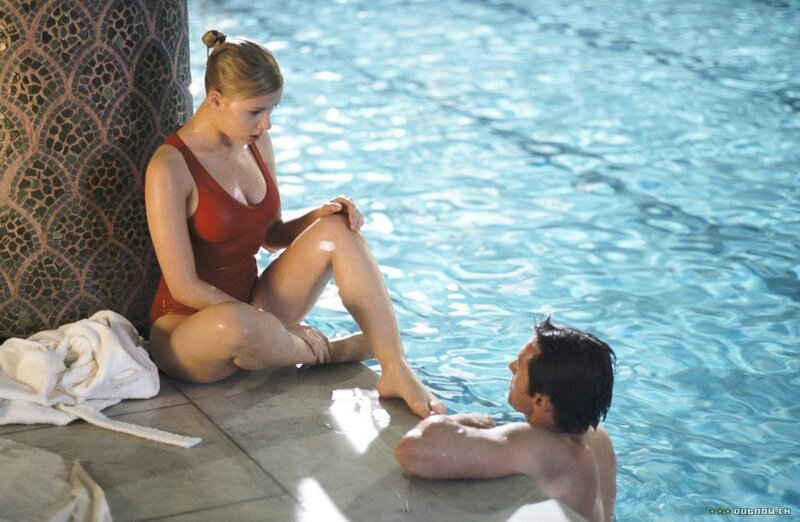 woman in red swimsuit by pool