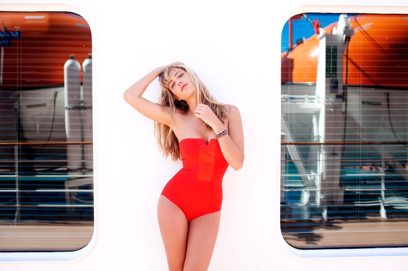 Woman in red swimsuit on ship