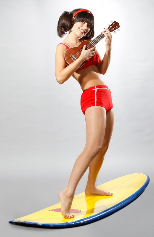 Woman in red swimsuit with ukulele