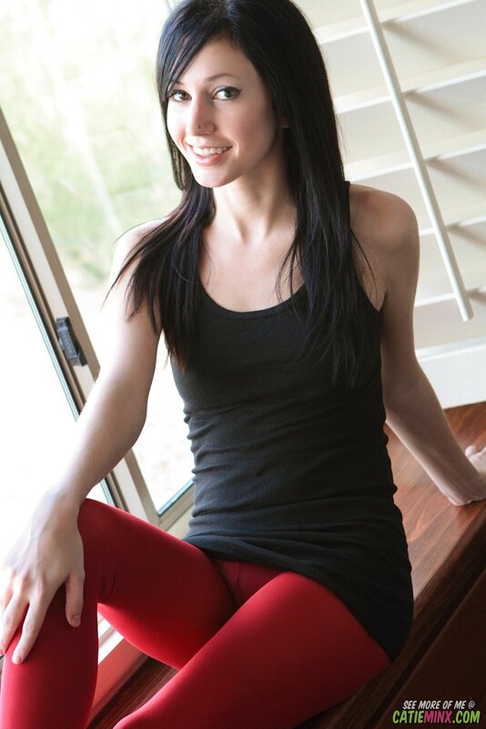 woman in red tights sitting