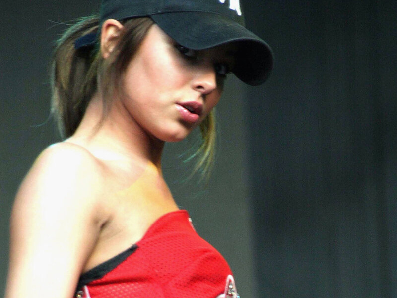 woman in red top and cap