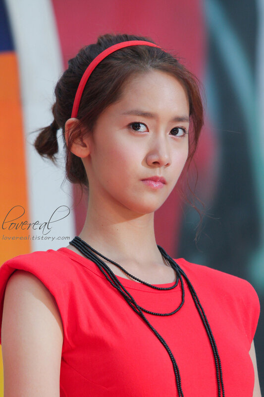 woman in red top and headband
