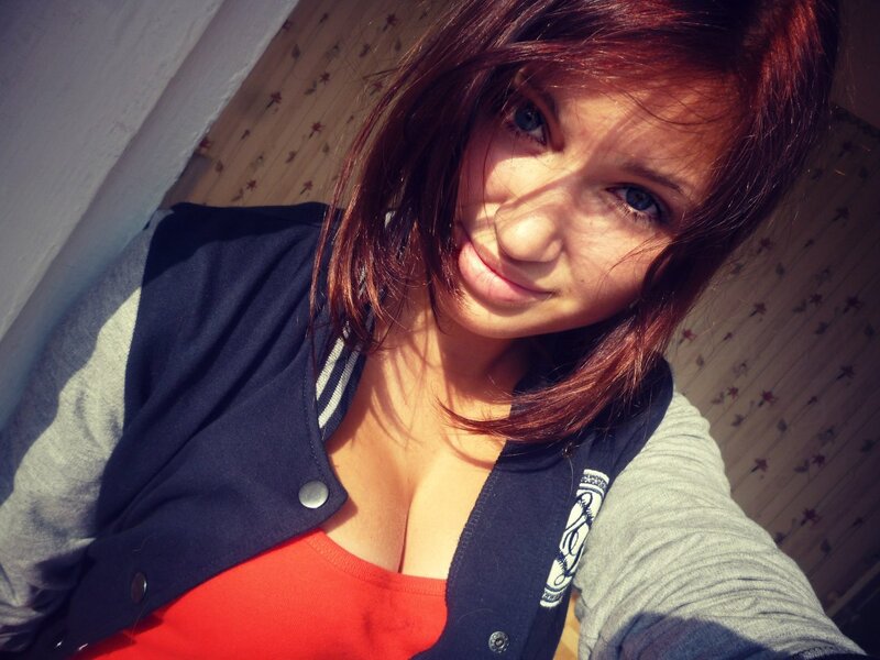 woman in red top and jacket