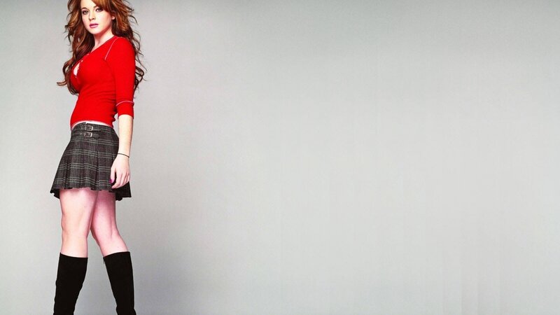 woman in red top and plaid skirt