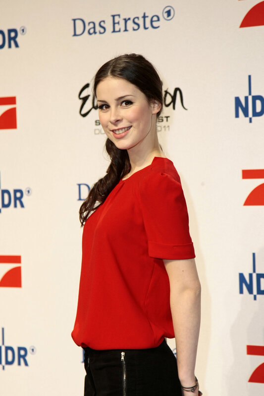 woman in red top at event