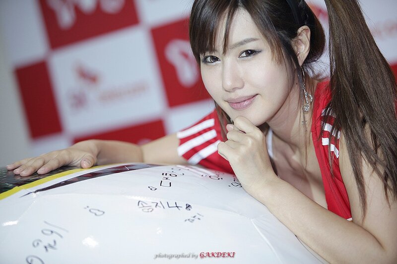 woman in red top at event