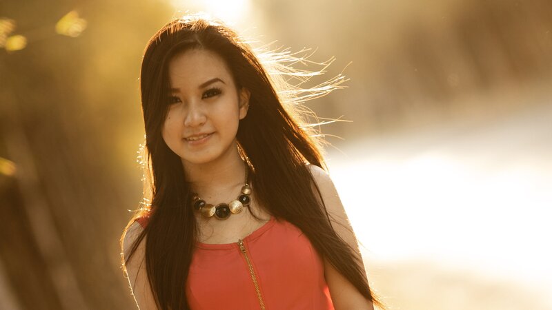 woman in red top at sunset