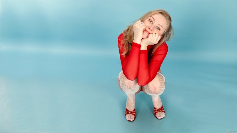 woman in red top crouching