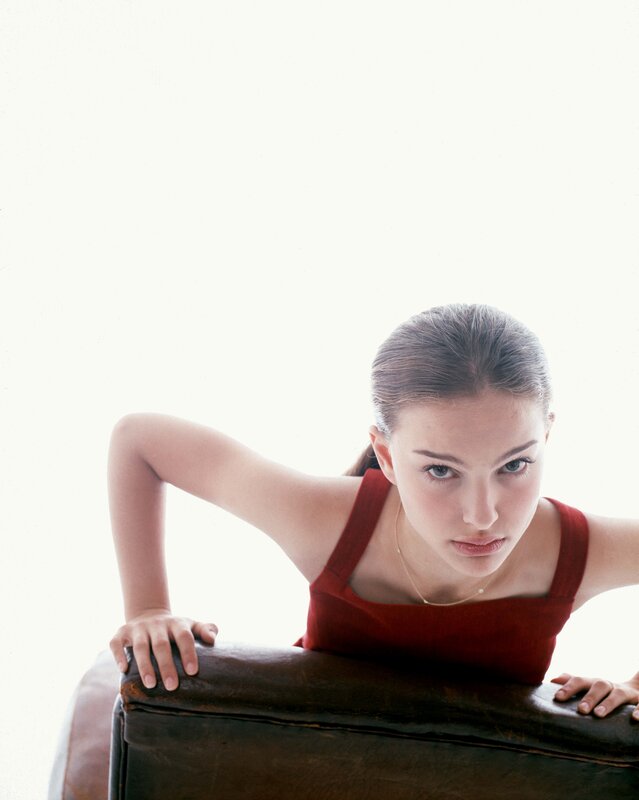 woman in red top leaning forward