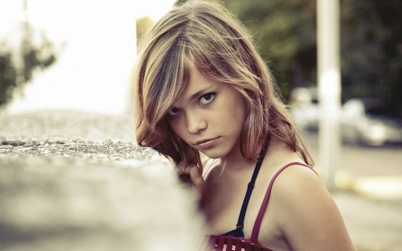 woman in red top looking at camera