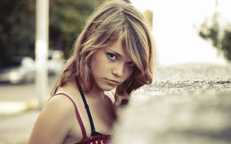woman in red top looking at camera