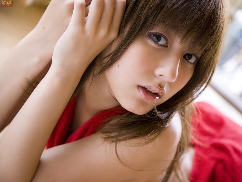 woman in red top looking at camera