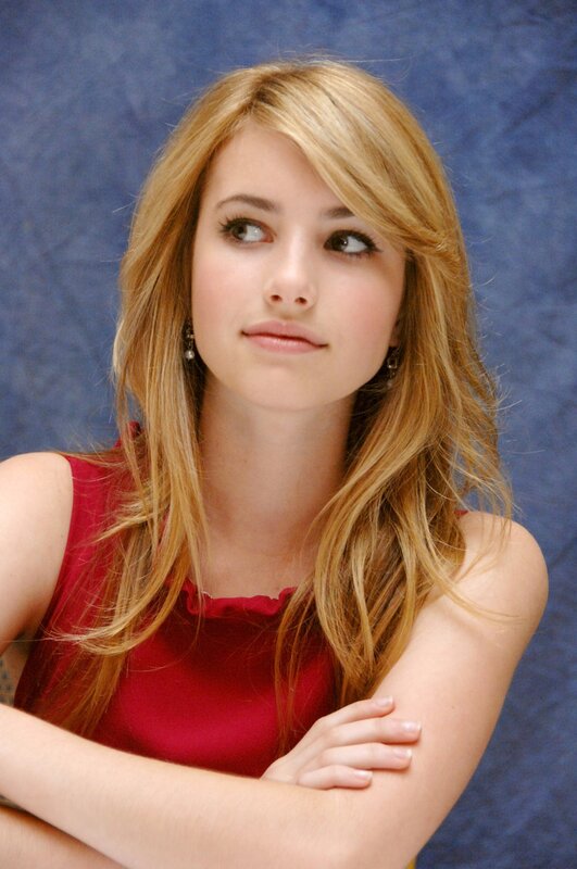 woman in red top looking away