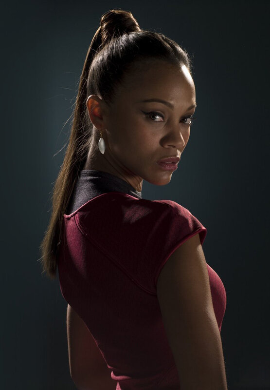 woman in red top looking back