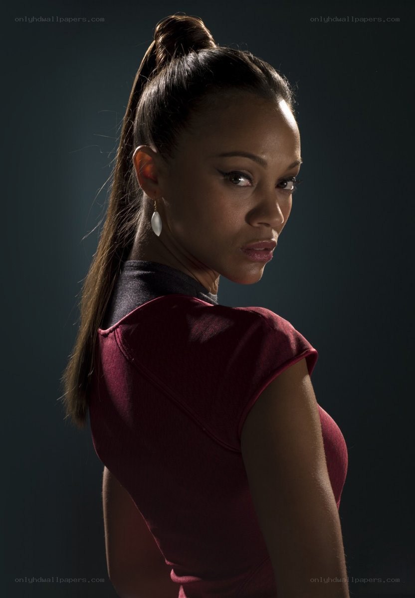 woman in red top looking back