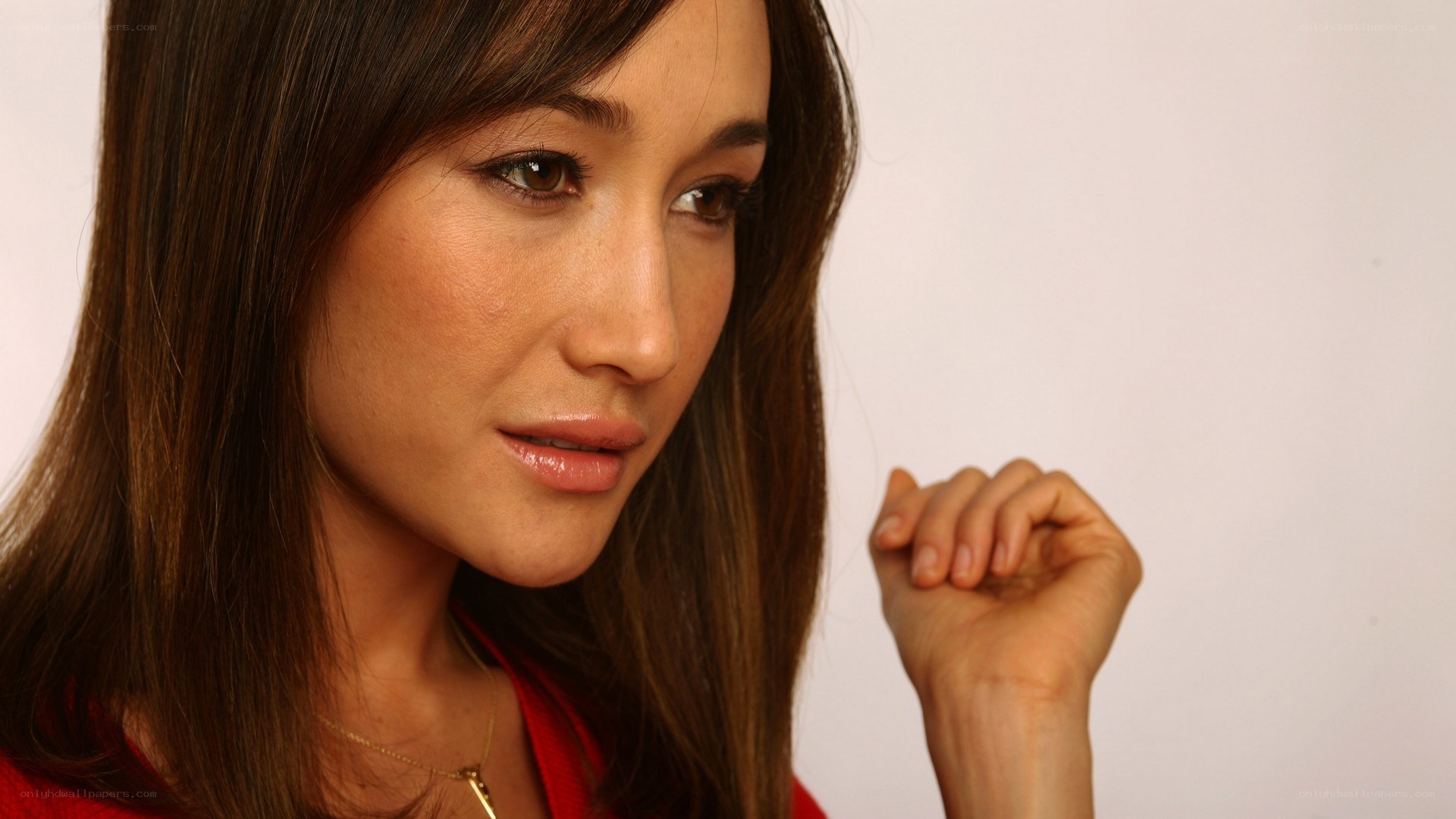 woman in red top looking down