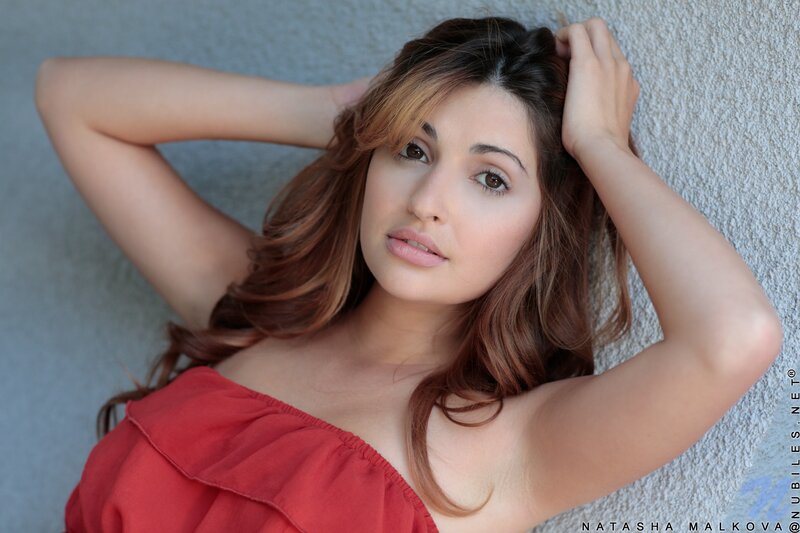 woman in red top lying down