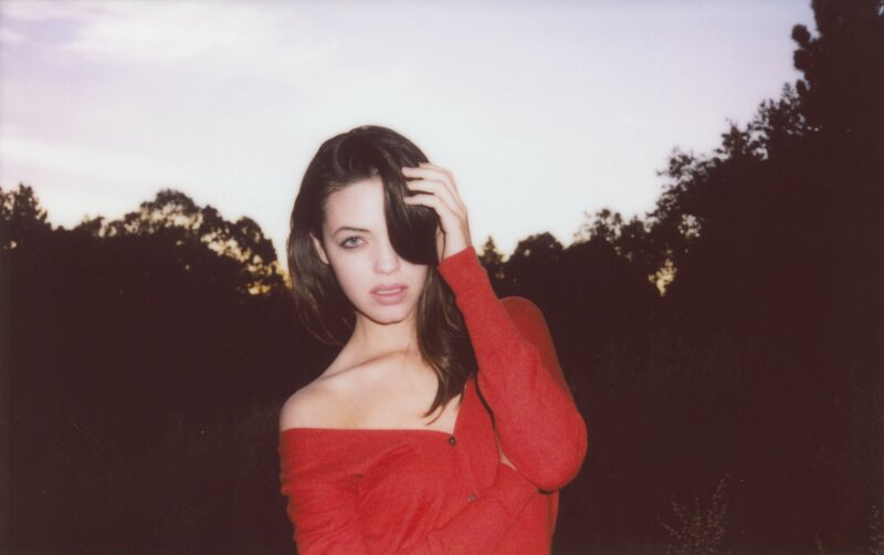 woman in red top outdoors